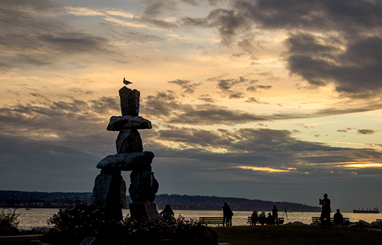 English bay Vancouver. Inukshuk sunset